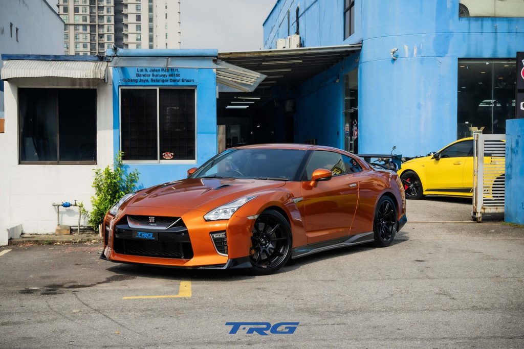 Orange Nissan GT-R R35 outside the TopRacing Garage workshop in Bandar Sunway