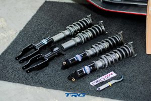 The full Neotech coilover kit laid out, two front units with fork brackets and two rear units with eye mounts